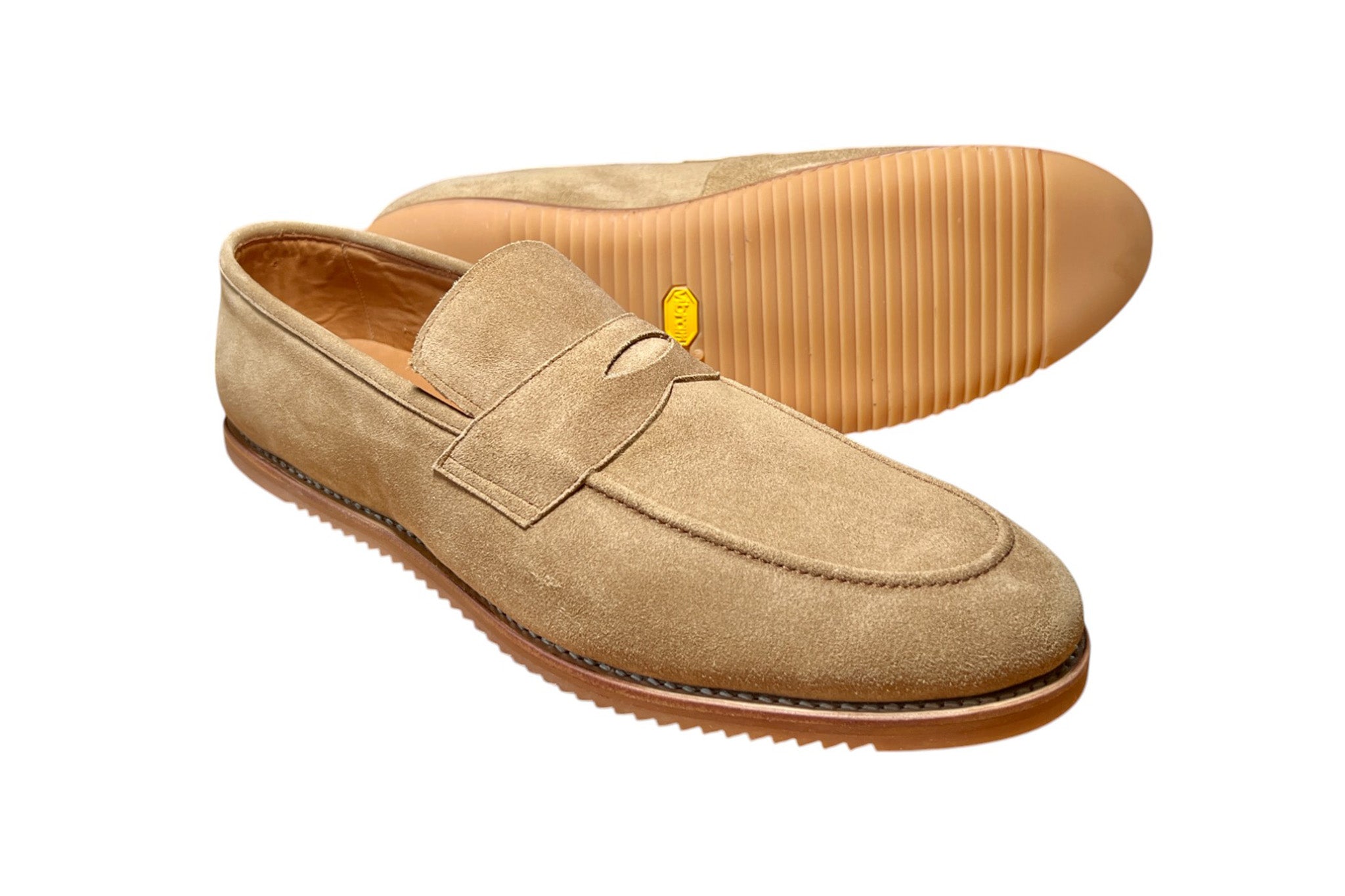 A pair of Zero Drop Wide Toebox Tan Suede Penny Loafers